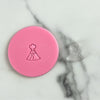 mini volcano cookie stamp shown next to stamped fondant design