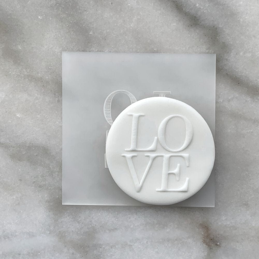 Custom designed cookie featuring raised fondant "LOVE" lettering