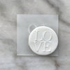 Custom designed cookie featuring raised fondant 