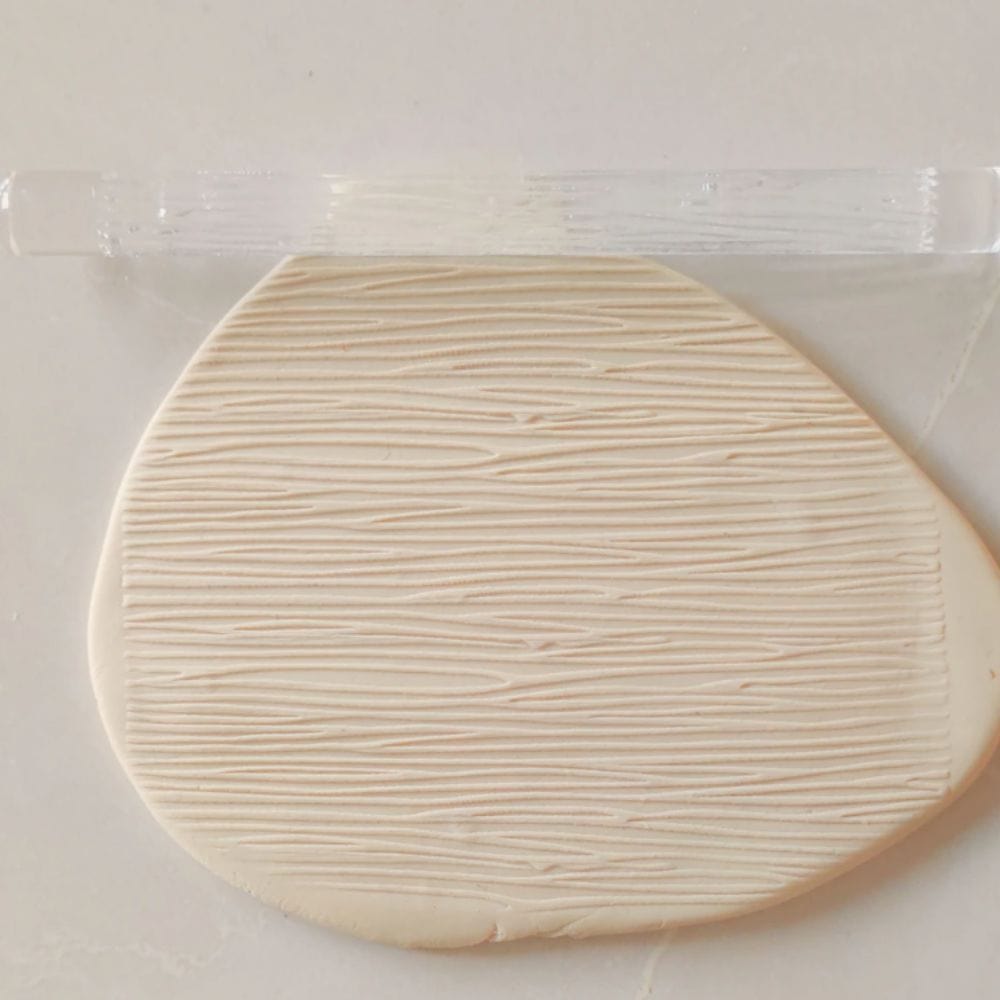 Close-up of Acrylic Embossed Rolling Pin with Woodgrain Pattern Design | Ideal for Fondant Details