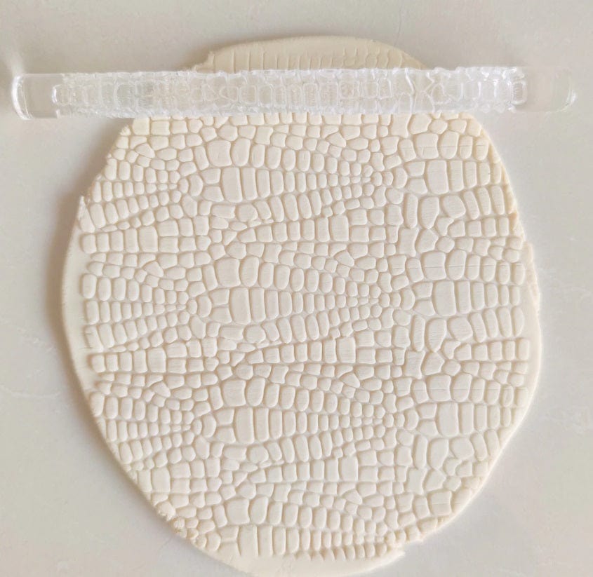 Close-up of Acrylic Embossed Rolling Pin with Pebble Pattern Design | Ideal for Fondant Details