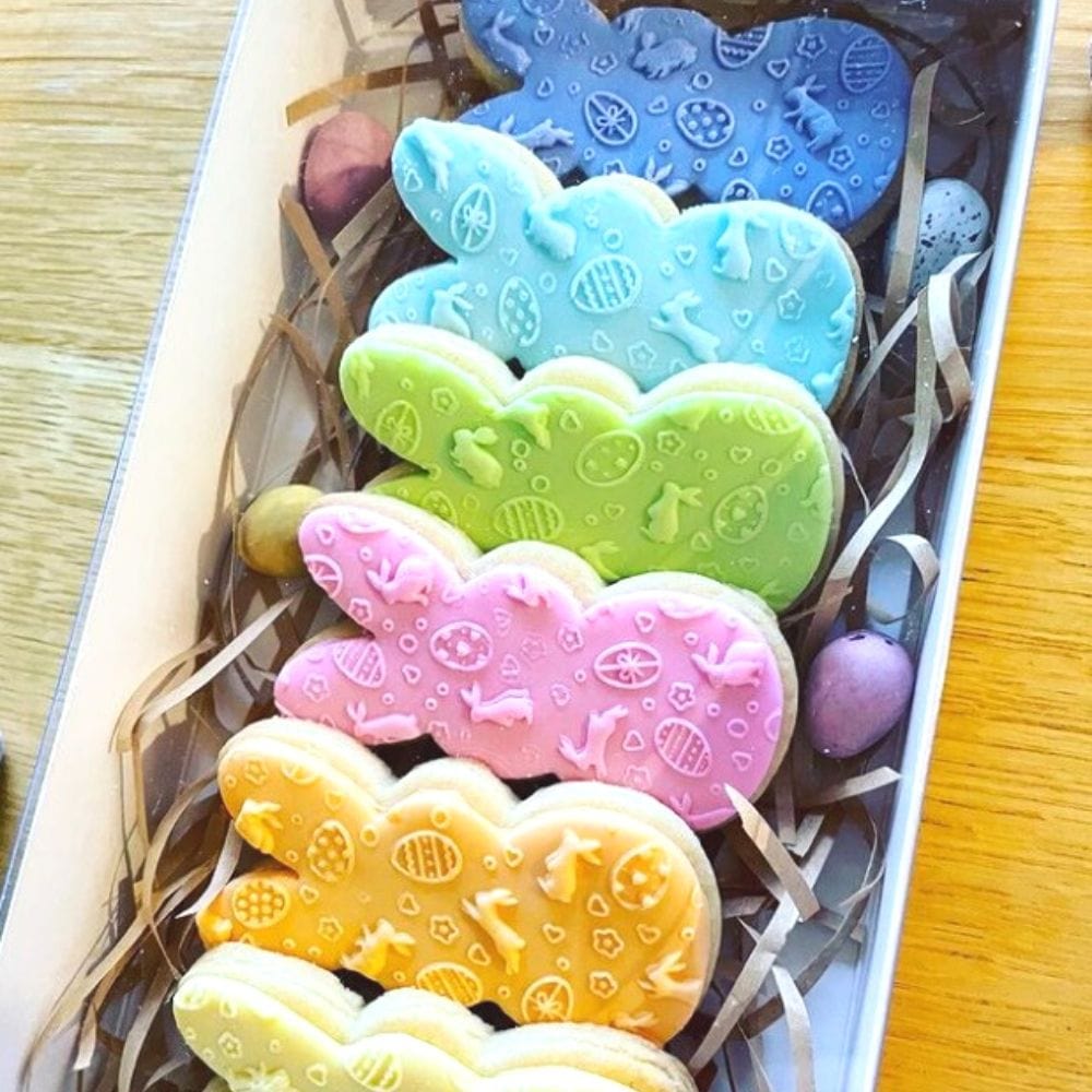 pack of easter themed cookies decorated with fondant debosser