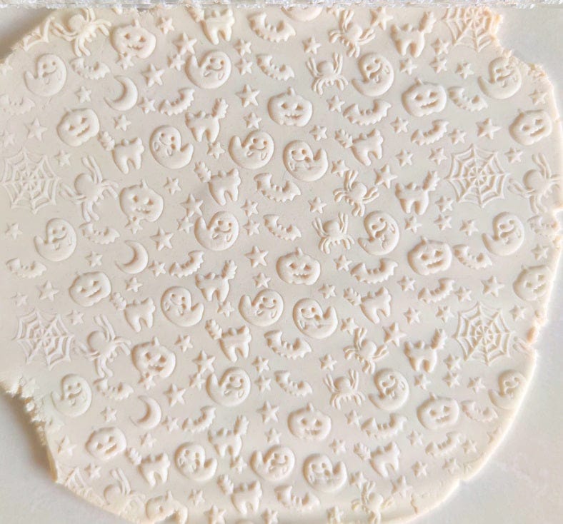 Close-up of Acrylic Embossed Rolling Pin with Halloween Creatures Design | Ideal for Fondant Details