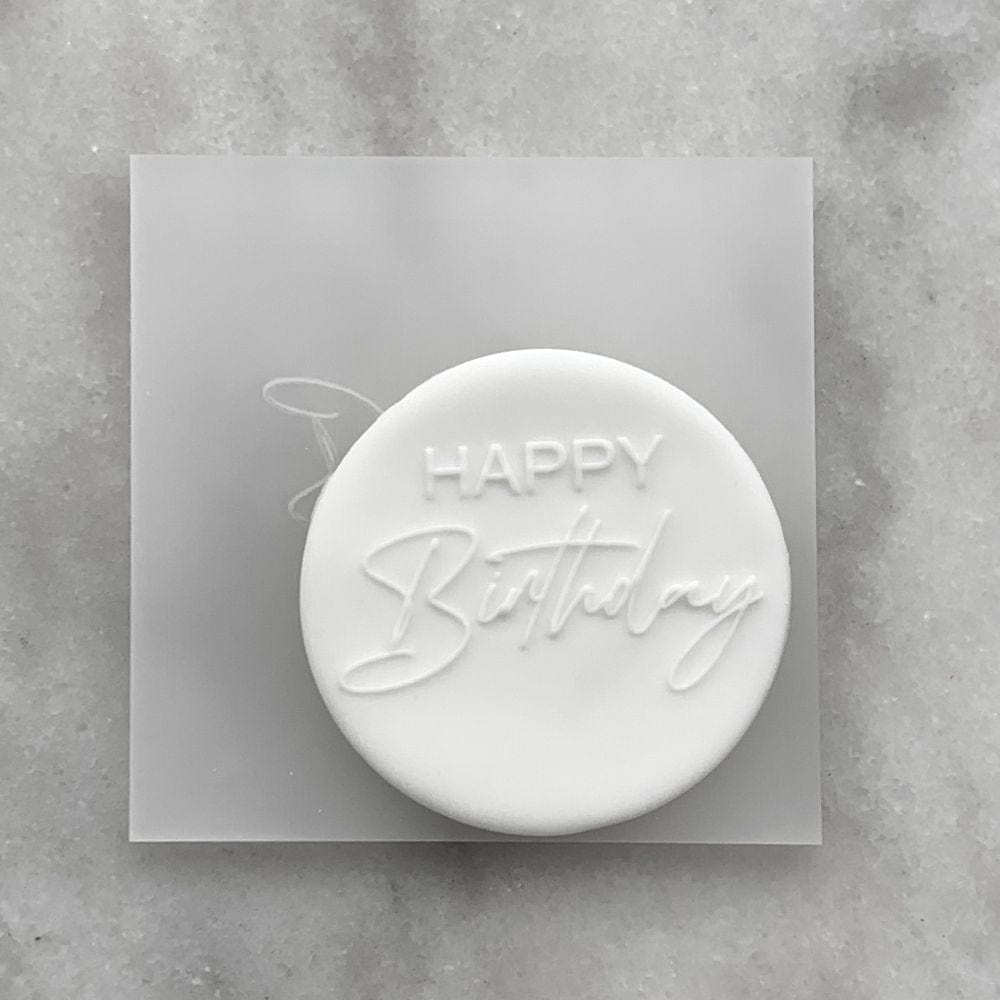 Custom acrylic embosser with "Happy Birthday" design displayed on top, ready for use