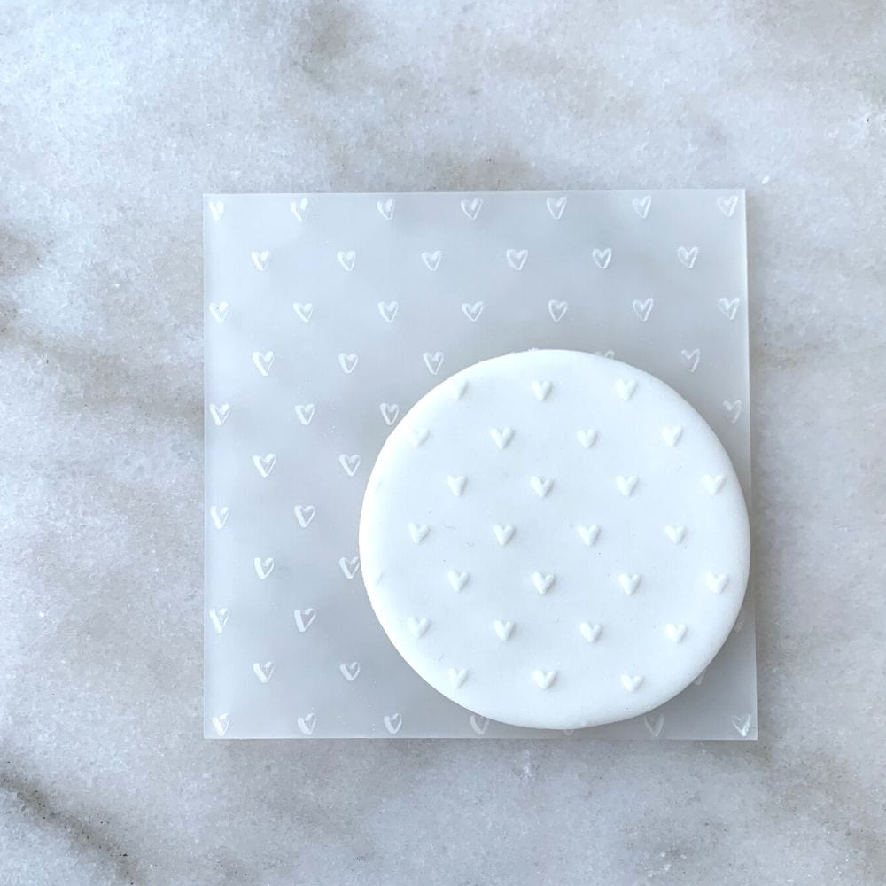 Mini Hearts design embossed on fondant using acrylic debosser.